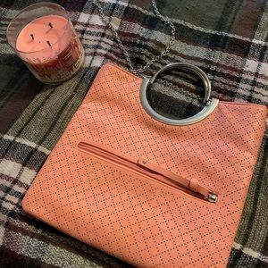 Kelly & Katie faux leather peach / salmon crossbody with a silver chain strap